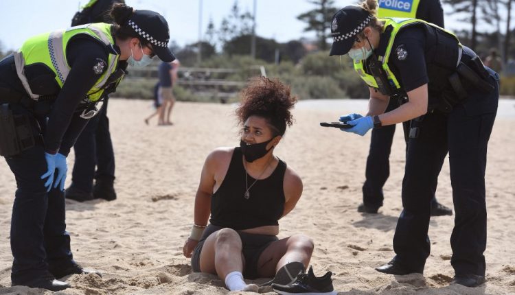 Aussies defy COVID limits and crowd Victoria’s beaches, parks | Australia