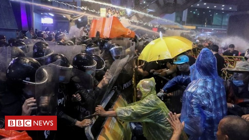Thailand protests: Riot police fire water cannon as protesters defy rally ban