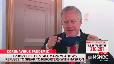 Mark Meadows takes off his mask.