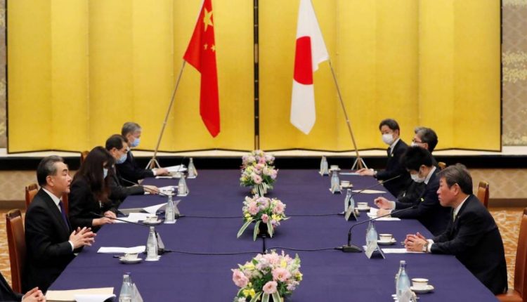 China’s Wang meeting Suga in first high-level talks with Japan PM | China