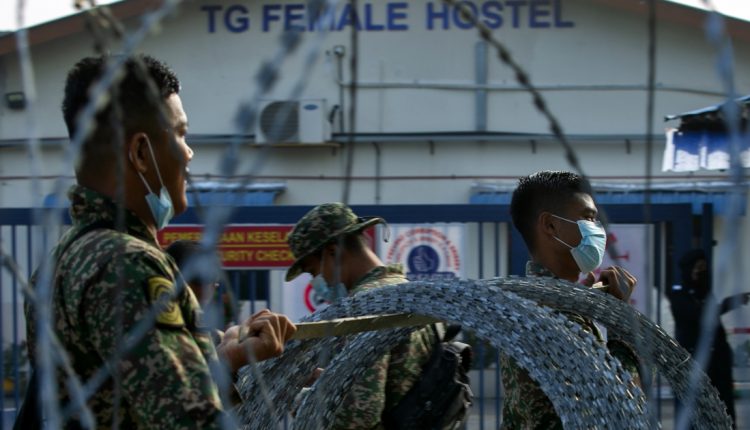 Top Glove shares drop as worker hostels put under strict lockdown | Malaysia