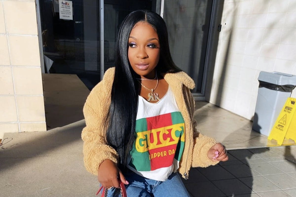Reginae Carter Wishes A Happy Birthday To Robert Rushing And All Fans See Is Her Bold Look In The Family Photo