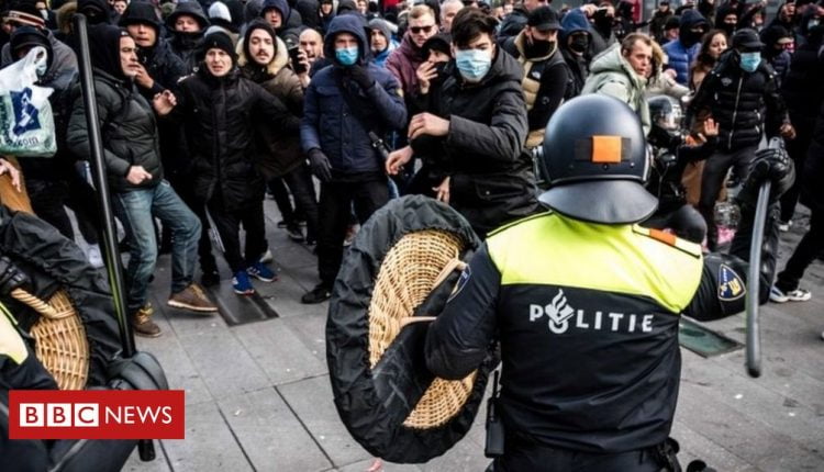 Covid: Police and protesters clash during Dutch curfew demo