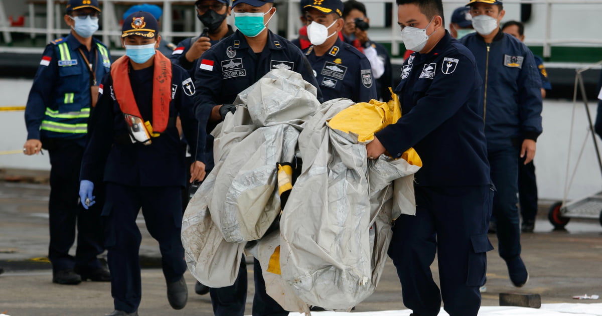 Body parts, debris found at Indonesian plane crash site | Indonesia News